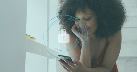 Leaning woman in red dress checking smartphone with digital lock overlay for home privacy