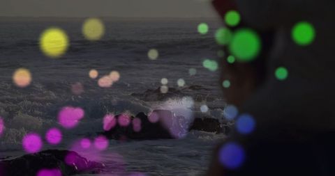 Mystical beachscape with bokeh lights at twilight