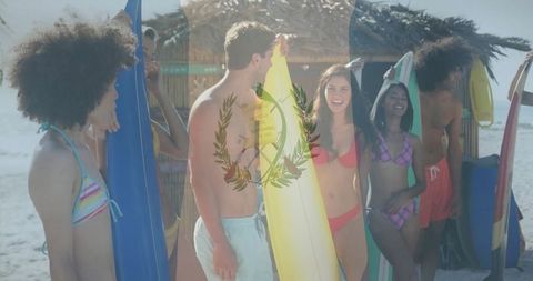 Group of Friends Hanging by Surfboards on Sunny Beach
