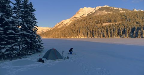 Winter Camping Adventure in Snow-Covered Mountain Landscape - Download Free Stock Images Pikwizard.com