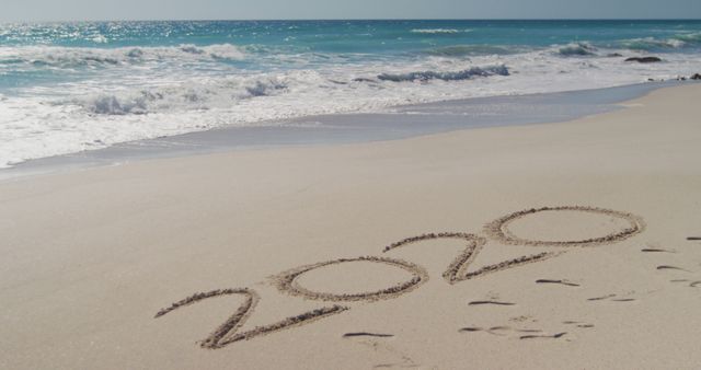 2020 Written on Sandy Beach with Ocean Waves - Download Free Stock Images Pikwizard.com