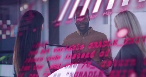 Business team collaborating behind glass with magenta data reflections
