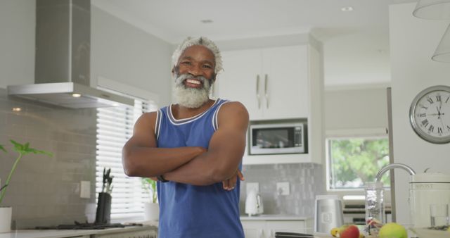 Smiling Elderly Man Cooking in Bright Modern Kitchen - Download Free Stock Images Pikwizard.com