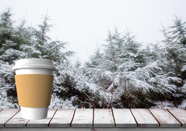 Digital composition of disposable coffee cup on wooden plank against winter forest in background