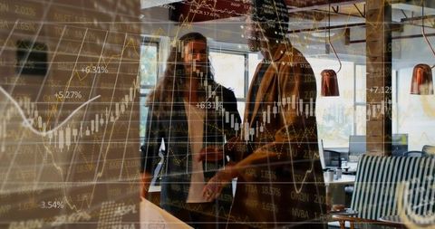 Professionals Analyzing Stock Data with Financial Charts Overlay