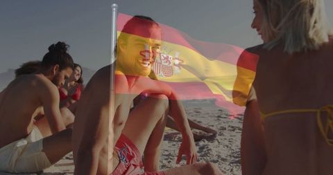 Group Friends Enjoying Relaxing Beach Day with Spanish Flag