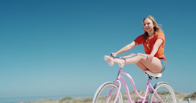 Young Woman Enjoying Ride on Pink Bicycle Outdoors - Download Free Stock Images Pikwizard.com