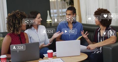 Diverse team discussing social media engagement strategies