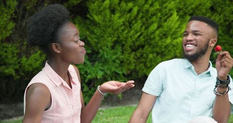 Young Couple Enjoying Relaxing Picnic in Sunny Park