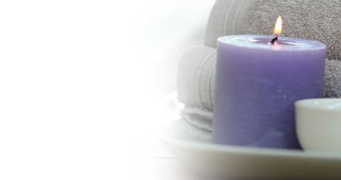 Purple Candle and Soft Towels for Relaxation Spa Theme - Download Free Stock Images Pikwizard.com