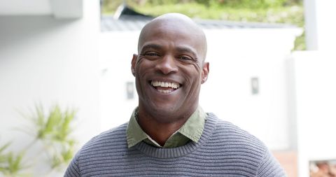 Smiling African American Man Relaxing on Garden Terrace - Download Free Stock Images Pikwizard.com