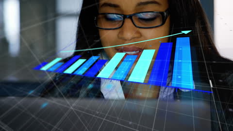 Businesswoman Analyzing Data with Bar Graph Overlay in Office