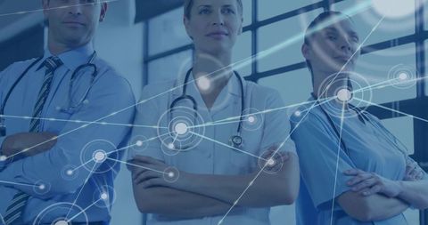 Medical team standing arms crossed digital network overlay for healthcare collaboration