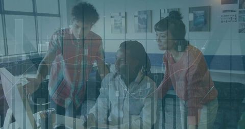 Multicultural team collaborating at computer with data visualization overlays and charts