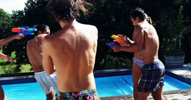 Friends Playing with Water Guns by Poolside on a Sunny Day - Download Free Stock Images Pikwizard.com