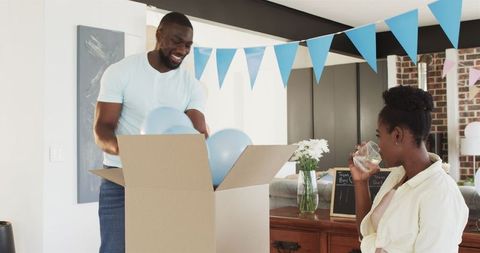 Couple Celebrating Baby Shower with Decorations and Joyful Moments