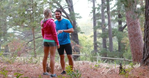 Couple Enjoying Forest Hike in Activewear