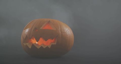Spooky Glow Jack O'Lantern against Foggy Background - Download Free Stock Images Pikwizard.com
