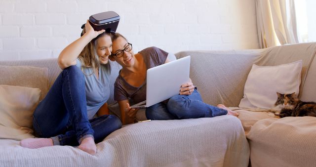 Mother and Daughter Enjoying Quality Time with VR Headset and Laptop - Download Free Stock Images Pikwizard.com