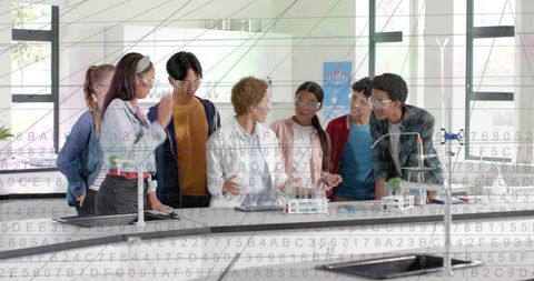 High school students conducting chemistry experiment collaborating at science lab bench