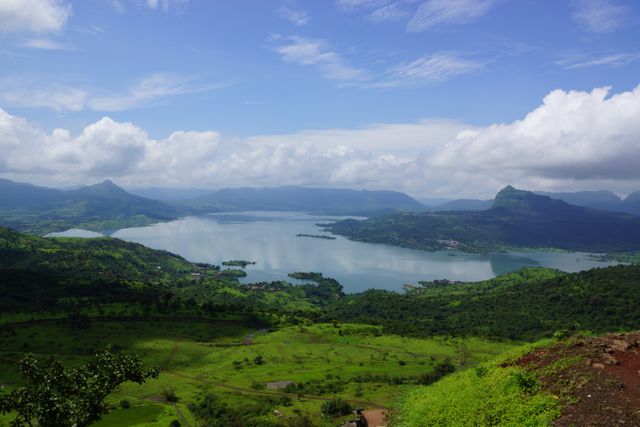 Scenic View of Lush Green Valley and Lake On Sunny Day - Download Free Stock Photos Pikwizard.com