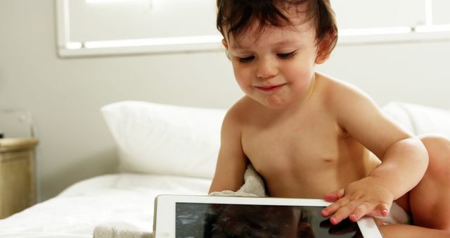 Smiling Baby Playing with Tablet in Bright Room - Download Free Stock Images Pikwizard.com