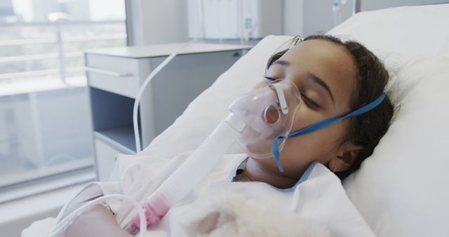 Young Girl Sleeping in Hospital Bed with Oxygen Mask - Download Free Stock Images Pikwizard.com