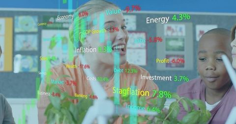 Smiling teacher leading STEM lesson with wind turbine, plants and financial data overlay
