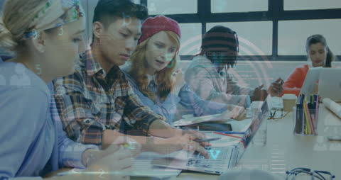 Diverse Team Analyzing Data on Digital Interface in Modern Workspace