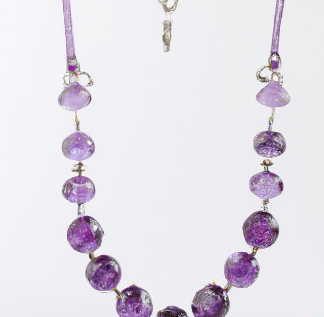 Beautiful purple stone beaded necklace featuring round and polished gemstones arranged in an elegant design. Suitable for use in fashion catalogs, jewelry advertisements, and social media posts showcasing luxury accessories.