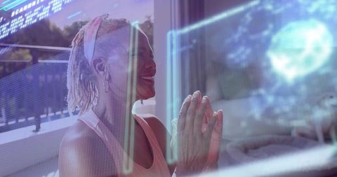 Senior woman practicing meditation using ar holographic interface on balcony for wellness