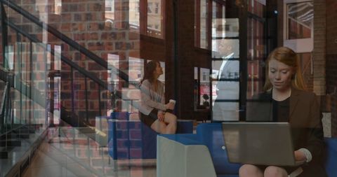 Business People Collaborating in Modern Office Lobby