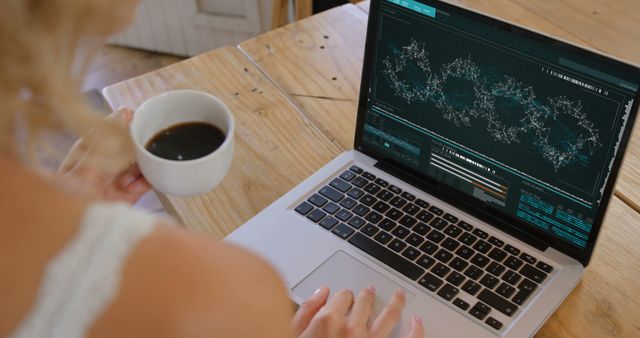 Researcher Analyzing Data on Laptop with Coffee Cup - Download Free Stock Images Pikwizard.com