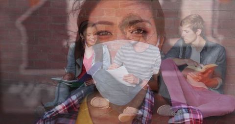 Multi-ethnic students collaborating with protective masks