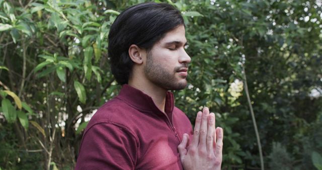 Young Man Meditating Outdoors in Lush Greenery - Download Free Stock Images Pikwizard.com