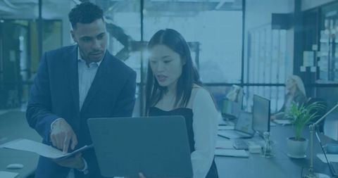 Diverse Colleagues Working on Project in Modern Office Environment