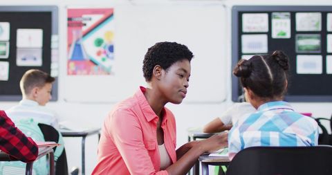Teacher Guiding Student in Inclusive Classroom Environment - Download Free Stock Images Pikwizard.com
