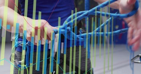 Indoor climber gripping blue rope harness carabiner closeup with performance data overlay