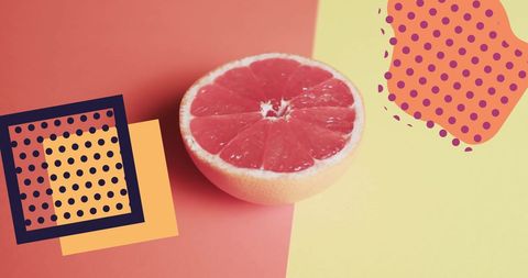 Halved grapefruit on vibrant abstract background great for healthy living