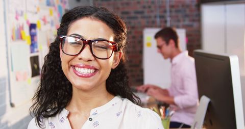 Smiling Businesswoman with Glasses in Modern Office Setting - Download Free Stock Images Pikwizard.com