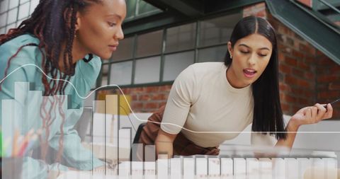 Colleagues Analyzing Financial Data at Office