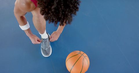 Athlete Tying Shoes Preparing for Basketball Game on Outdoor Court - Download Free Stock Images Pikwizard.com