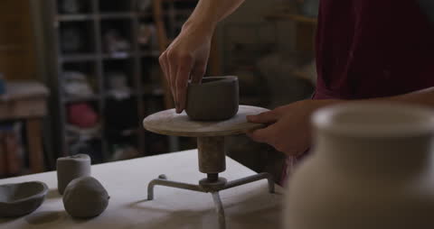 Caucasian Potter Crafting Clay Pot on Pottery Wheel