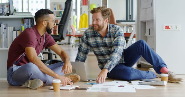 Two Male Colleagues Brainstorming Startup Ideas on Office Floor - Download Free Stock Images Pikwizard.com