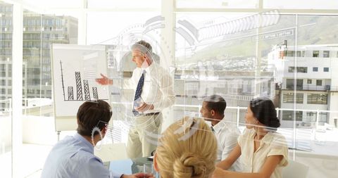 Businessman presenting data with futuristic interface graphics