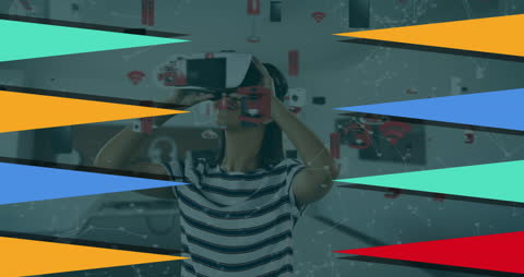 Woman Engaging with Virtual Reality Surrounded by Abstract Shapes
