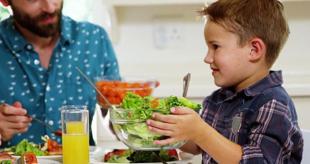 Father and Son Enjoying Healthy Meal Together at Home - Download Free Stock Images Pikwizard.com