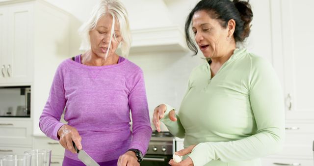 Senior Women Preparing Meal Together in Modern Kitchen - Download Free Stock Images Pikwizard.com