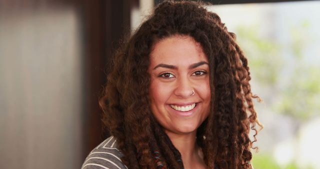 Portrait of Smiling Woman with Dreadlocks Indoors - Download Free Stock Images Pikwizard.com