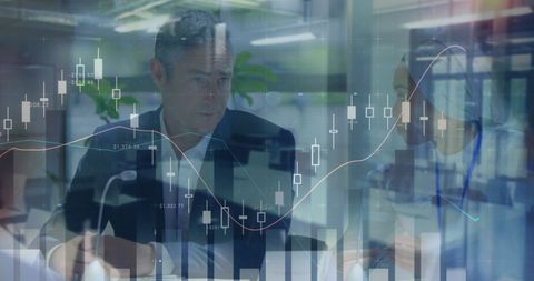 Business Executive Analyzing Financial Data Trends and Charts